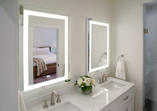 Two Allegro lighted mirrors over a vanity in a clean white primary suite bathroom