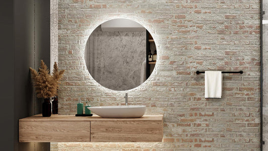  Séura Halo Round lighted mirror installed above a modern bathroom vanity